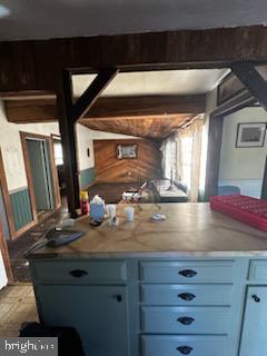 bar with blue cabinetry