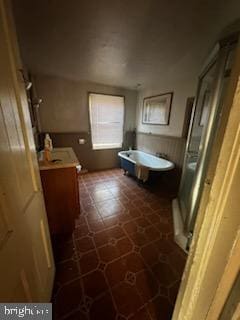 bathroom with vanity and independent shower and bath