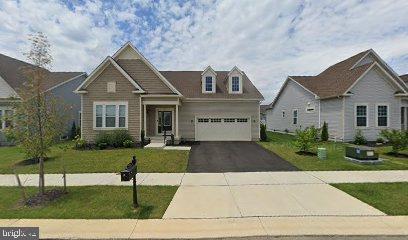 view of front of house with a front yard and a garage