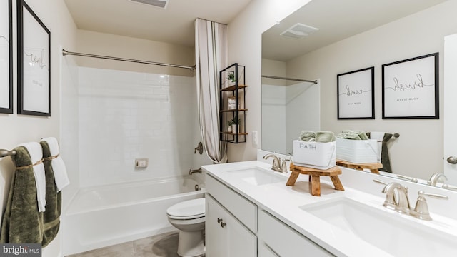 full bathroom with tile patterned floors, shower / washtub combination, vanity, and toilet