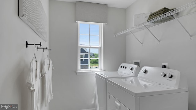 laundry area featuring washing machine and clothes dryer