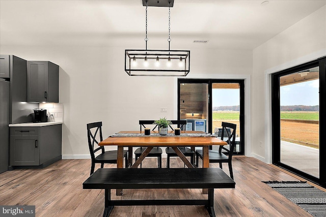 dining area with light hardwood / wood-style floors