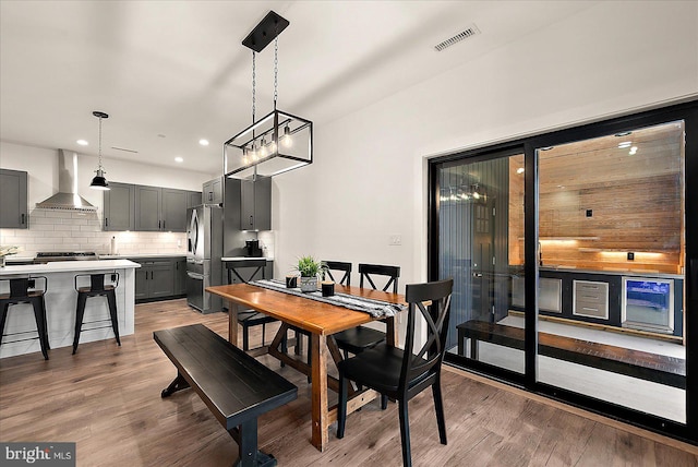 dining room with a chandelier and dark hardwood / wood-style flooring