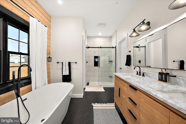 bathroom with separate shower and tub, tile patterned flooring, and vanity