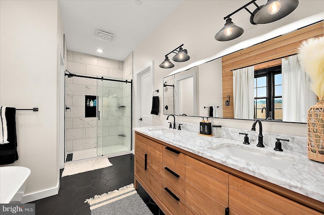 bathroom featuring tile patterned flooring, vanity, and an enclosed shower