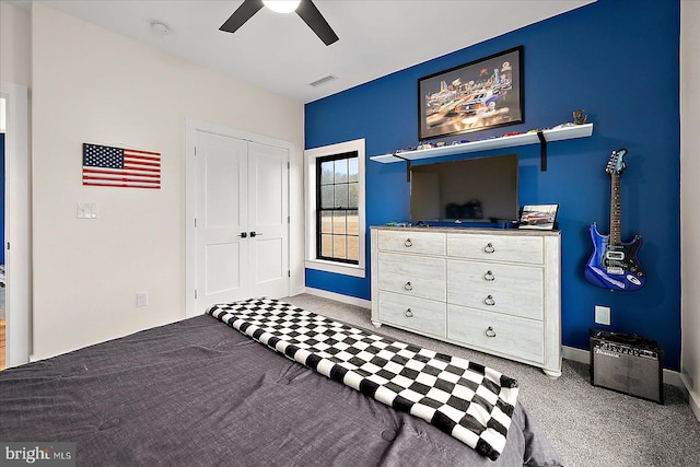 bedroom with carpet flooring, ceiling fan, and a closet