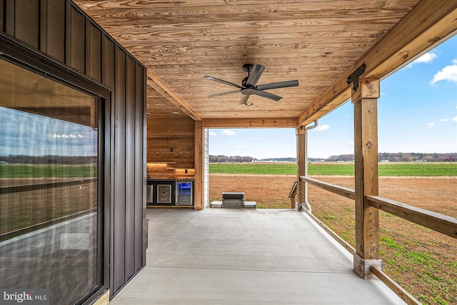 view of patio / terrace with a rural view and ceiling fan