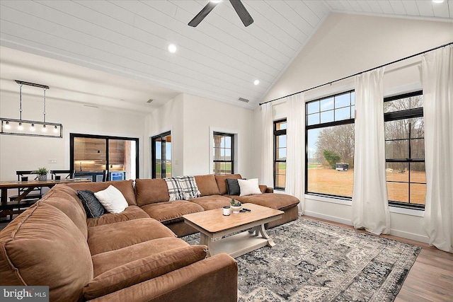 living room featuring light hardwood / wood-style flooring, high vaulted ceiling, ceiling fan, and wooden ceiling