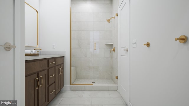 bathroom featuring vanity and a shower with shower door