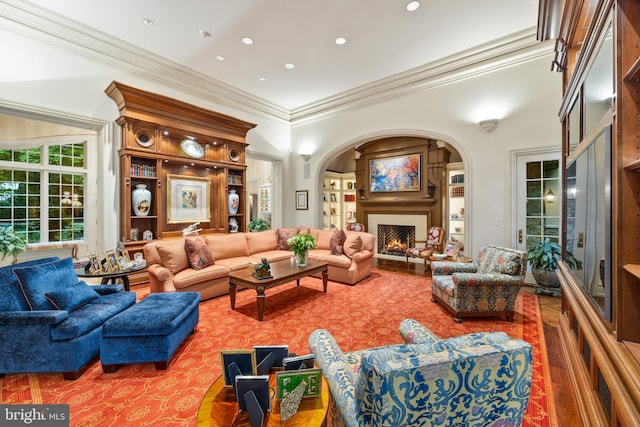 living room with hardwood / wood-style flooring and ornamental molding