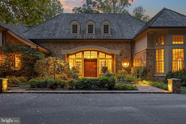 view of exterior entry at dusk