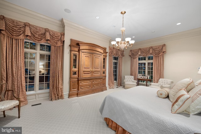 carpeted bedroom featuring ornamental molding and a chandelier