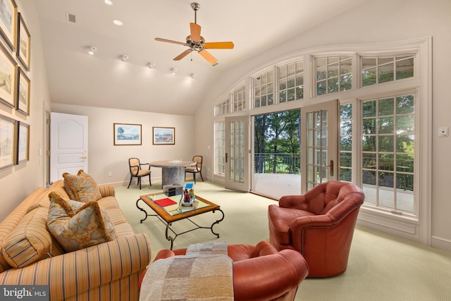 living room featuring ceiling fan, light carpet, high vaulted ceiling, and french doors