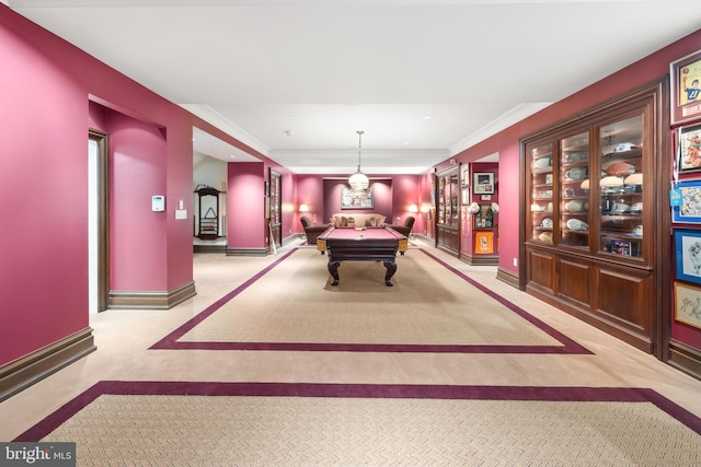 playroom featuring light colored carpet, ornamental molding, and billiards