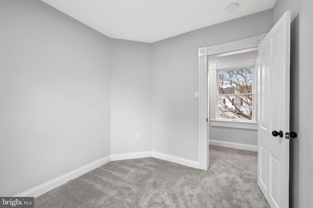 spare room with light colored carpet