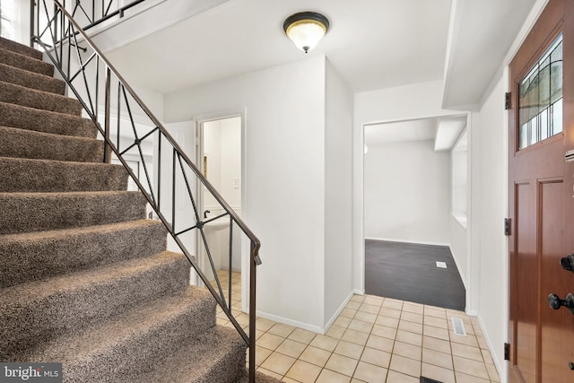 entrance foyer featuring light tile patterned floors