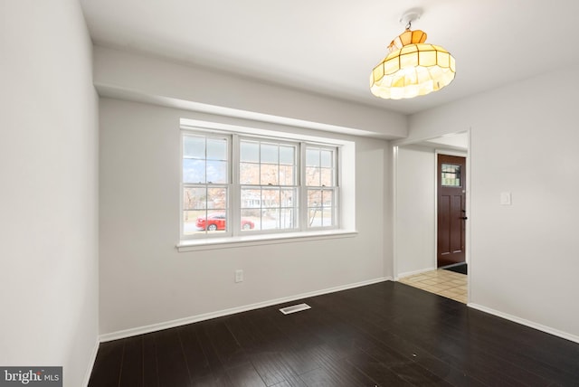 unfurnished room featuring hardwood / wood-style floors