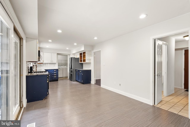 living room featuring light hardwood / wood-style floors and sink