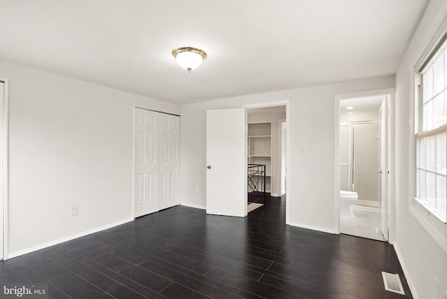 empty room featuring dark hardwood / wood-style floors