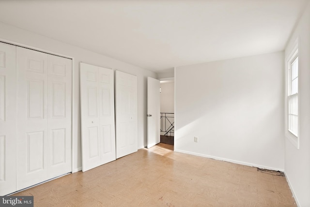 unfurnished bedroom featuring light wood-type flooring