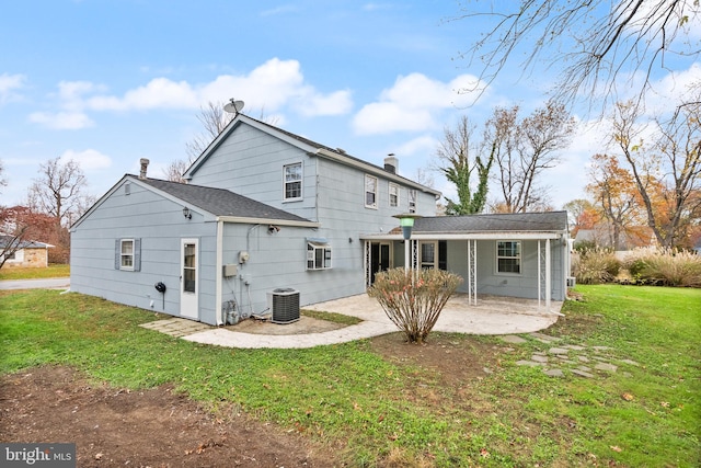 back of property featuring a patio, central AC, and a lawn