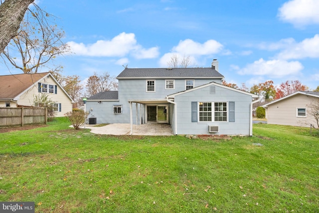 back of property featuring a yard, a patio, and central air condition unit