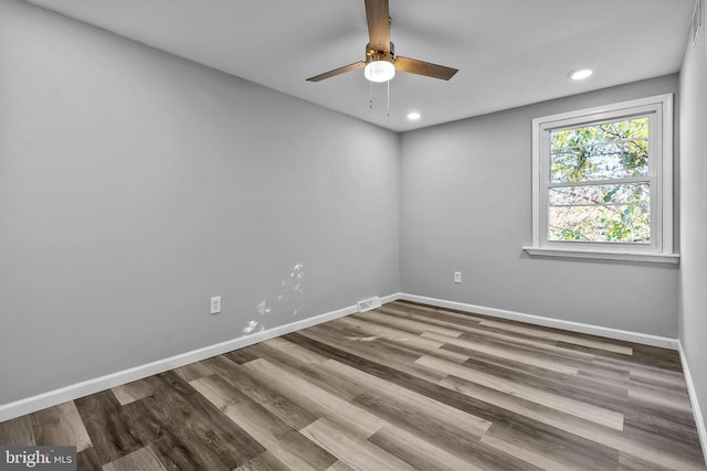 unfurnished room with hardwood / wood-style floors and ceiling fan