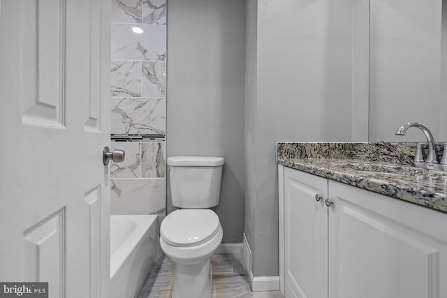 full bathroom featuring vanity, toilet, and tiled shower / bath combo