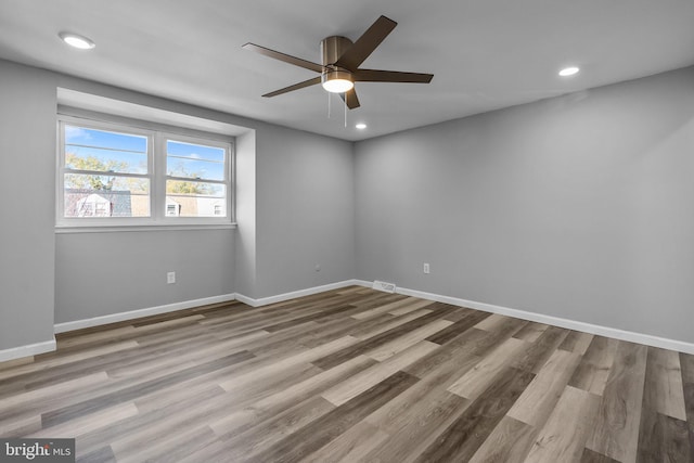 empty room featuring light hardwood / wood-style floors and ceiling fan