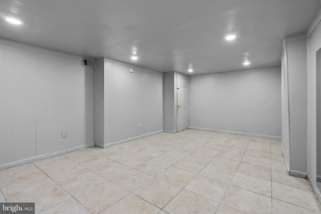 basement with light tile patterned flooring