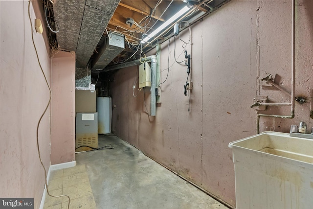 basement featuring gas water heater and sink