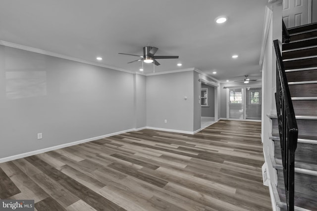 unfurnished living room with ornamental molding and hardwood / wood-style flooring