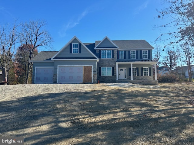 view of front of house featuring a garage and covered porch