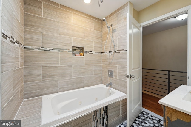 bathroom with tiled shower / bath combo and tile patterned floors