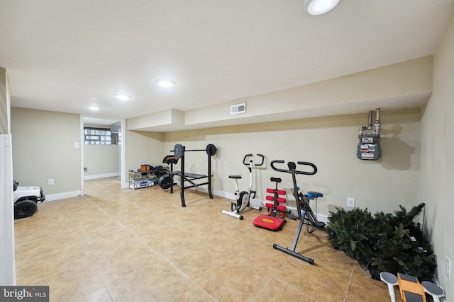 exercise room featuring tile patterned flooring