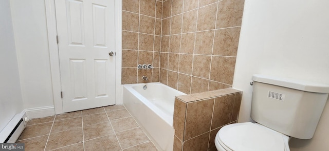 bathroom with a bathing tub, tile patterned flooring, toilet, and a baseboard heating unit