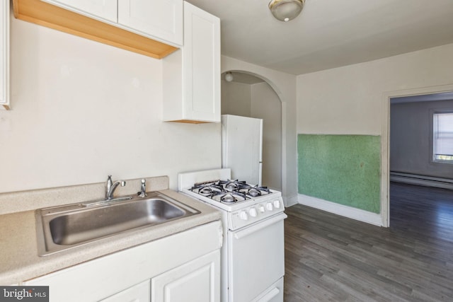 kitchen featuring white cabinetry, sink, dark hardwood / wood-style flooring, white range with gas stovetop, and a baseboard heating unit