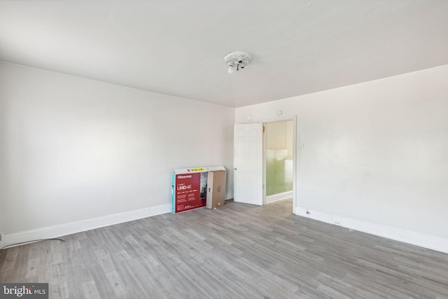 unfurnished room featuring light hardwood / wood-style floors