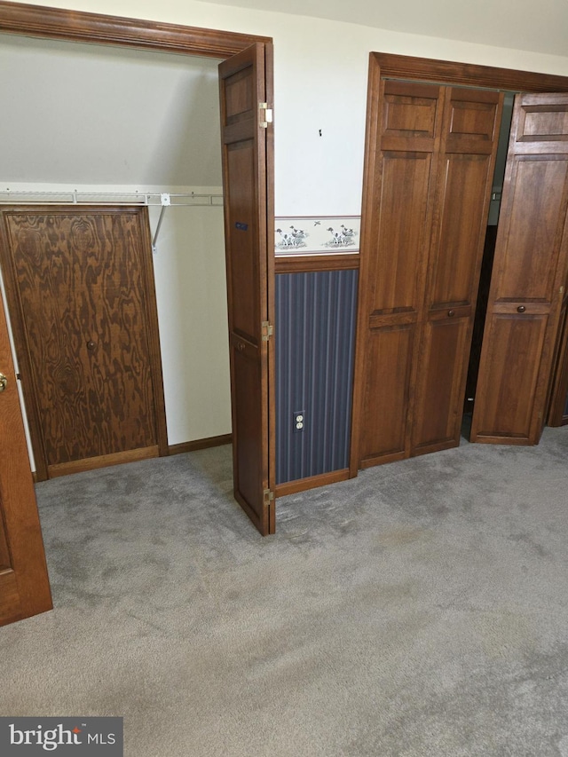 unfurnished bedroom with light carpet