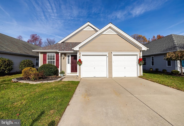 view of front of property with a front yard and a garage