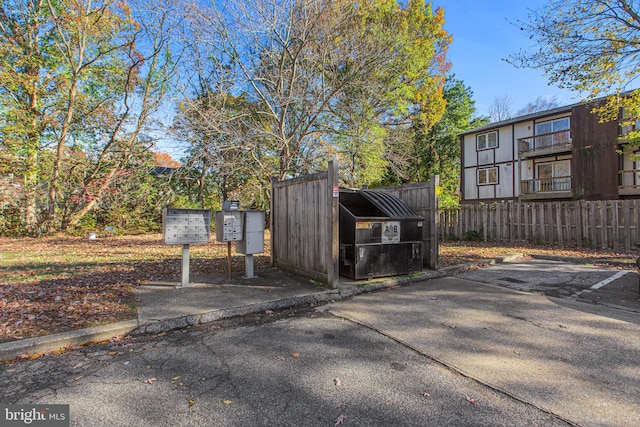 view of car parking featuring mail boxes