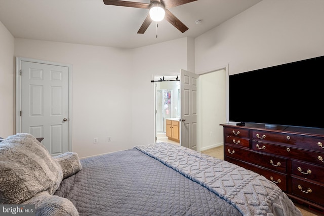 carpeted bedroom with ceiling fan and vaulted ceiling