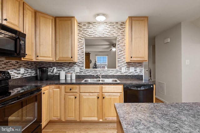 kitchen with decorative backsplash, sink, black appliances, and light hardwood / wood-style flooring