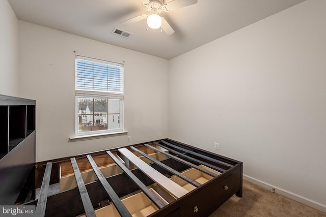 unfurnished bedroom featuring carpet floors and ceiling fan