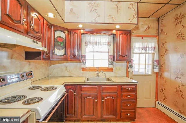 kitchen with sink, baseboard heating, a paneled ceiling, and electric stove