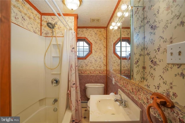 full bathroom featuring sink, toilet, a textured ceiling, a baseboard radiator, and shower / tub combo