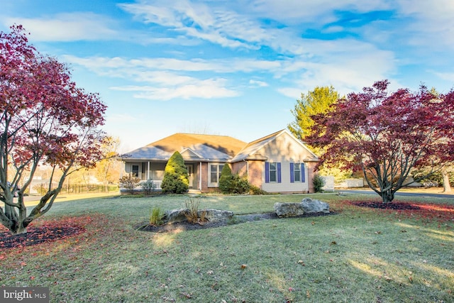 ranch-style house with a front lawn