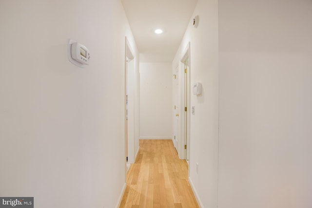 corridor featuring light hardwood / wood-style floors