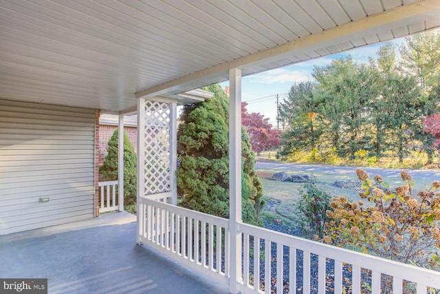 wooden terrace featuring a porch