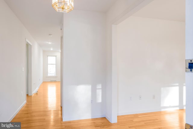 corridor featuring light hardwood / wood-style floors